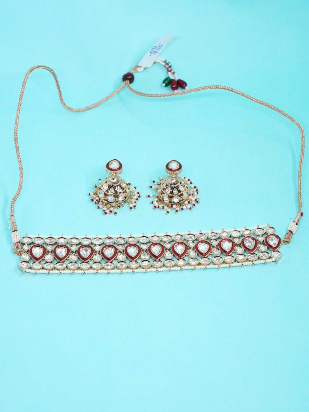 Mossonite Choker Necklace Set with Kundan Work and Earrings on blue background