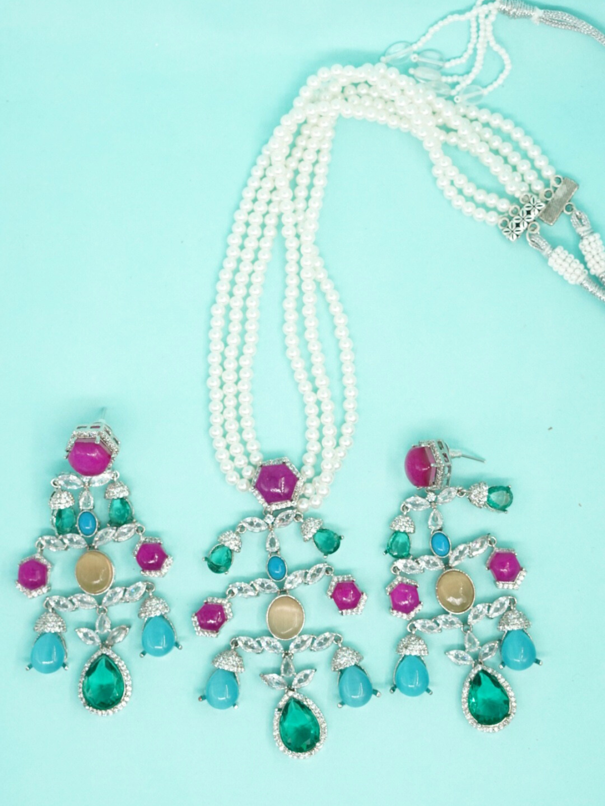 Sabyasachi-inspired pearl necklace set with multi-colored stone pendant and matching earrings close view
