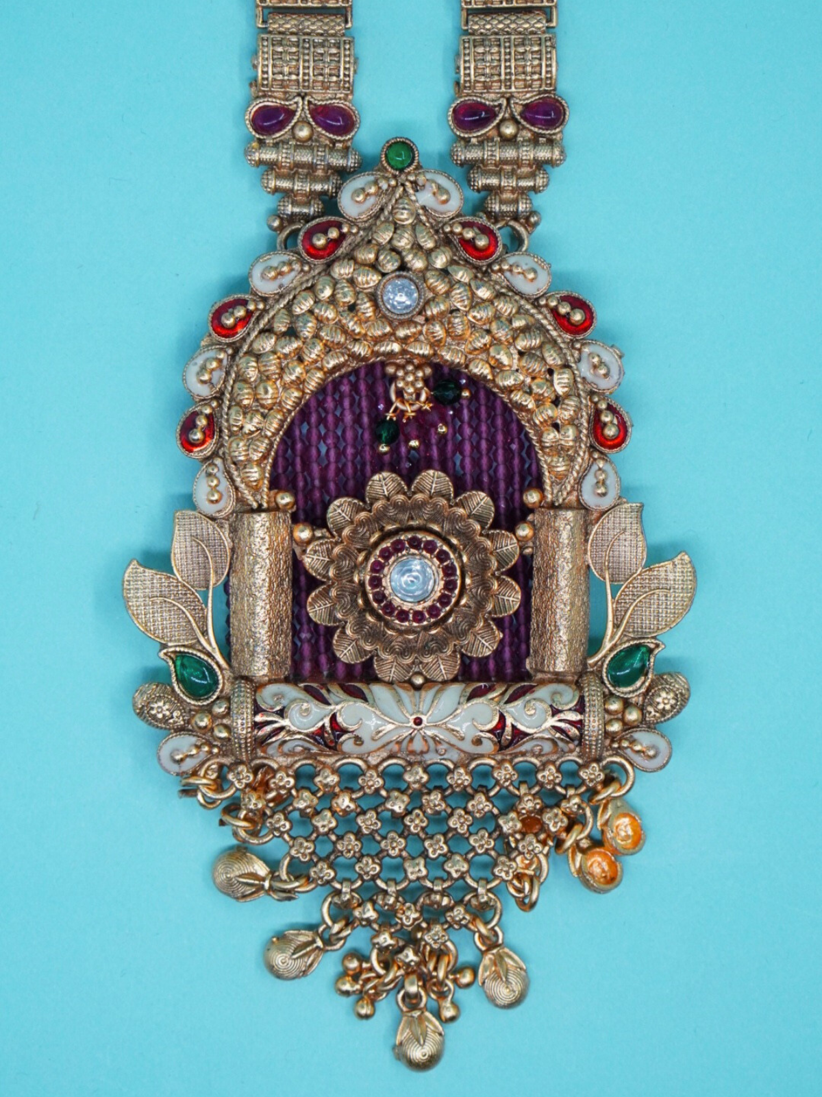 Temple-style long haram necklace set with antique pendan
