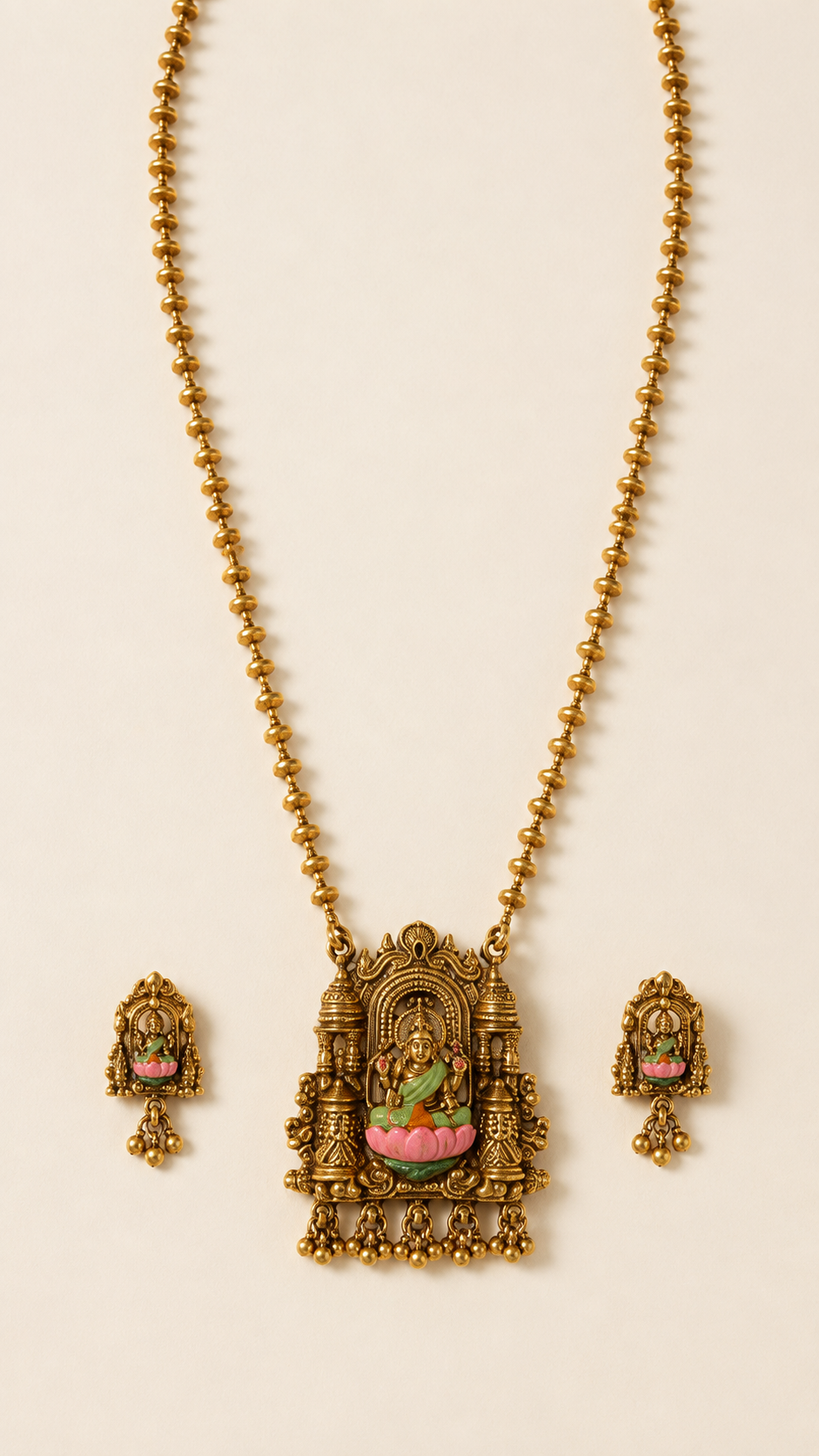 Brass Muttar Mala Lakshmi necklace set on an ivory background
