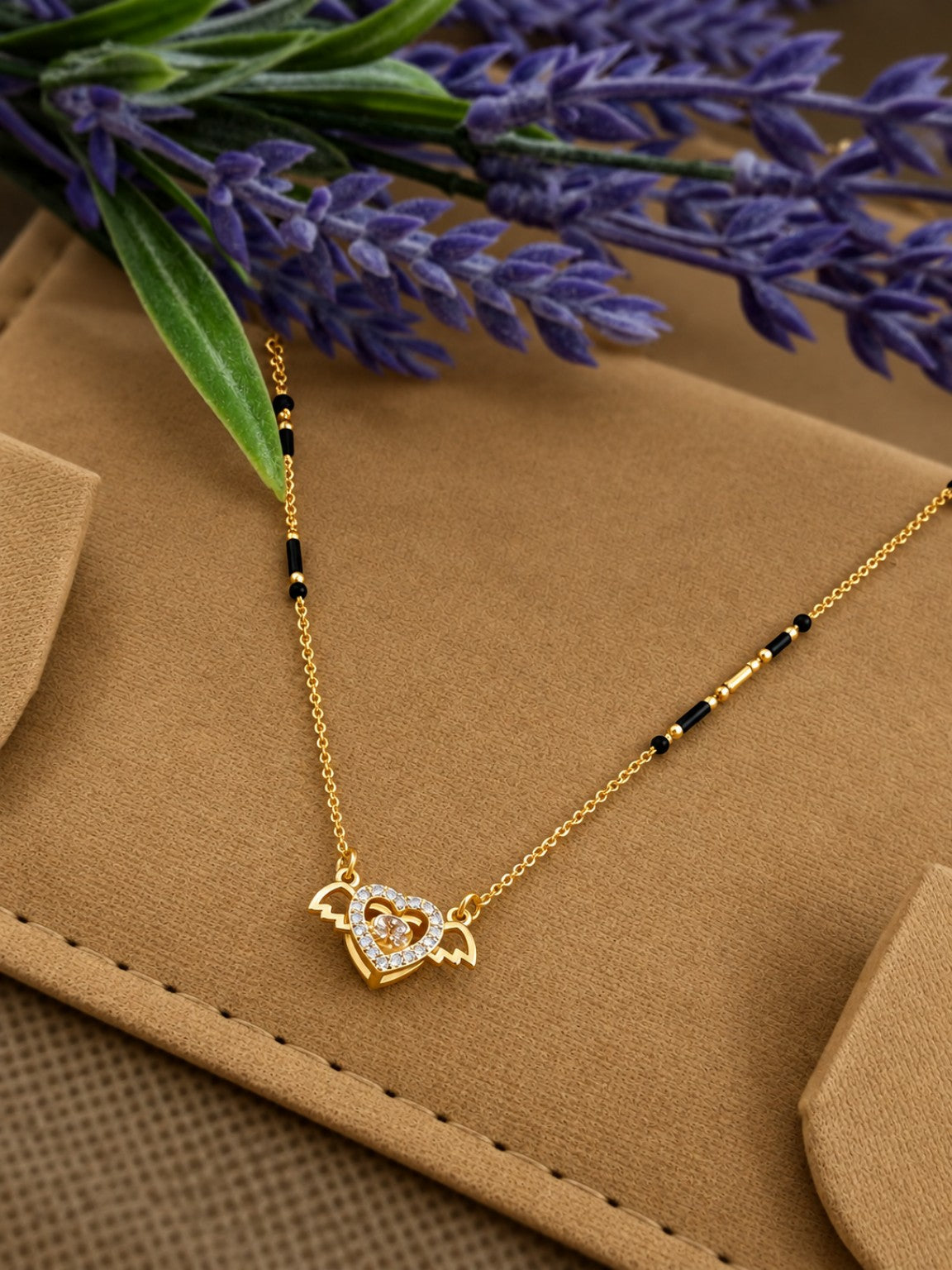 Micro gold-plated black bead mangalsutra with winged heart stone pendant