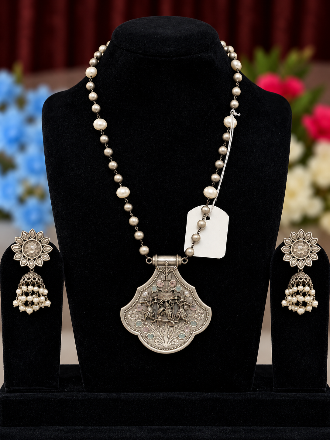 Oxidised silver replica temple scene pendant necklace set with pearl-style beads and matching jhumka earrings
