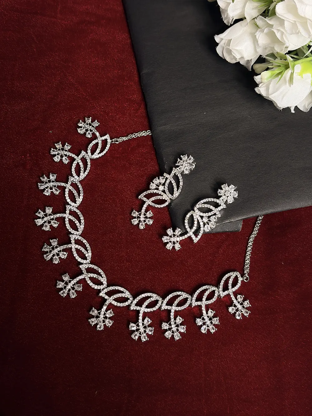 Silver White American Diamond Twisted Loop & Snowflake Necklace Set with Dangler Earrings