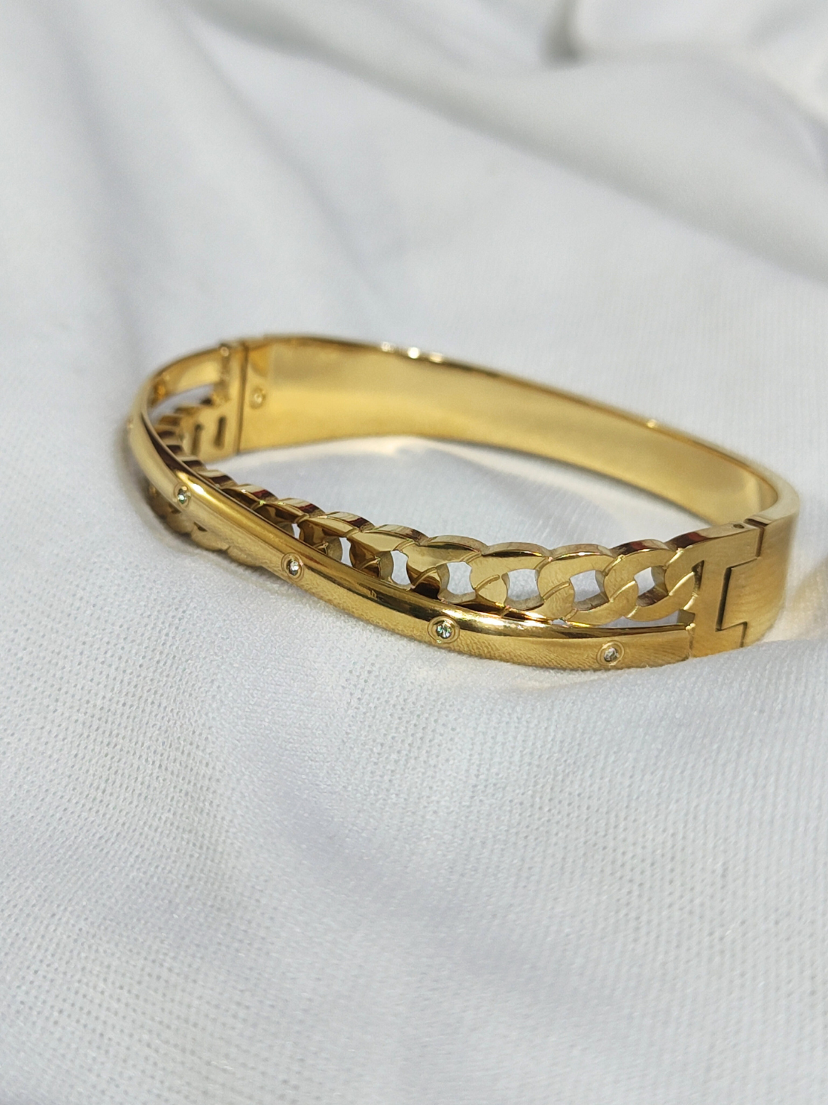 Anti tarnish gold-tone woven bracelet with stone studs close view
