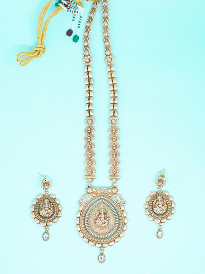 Antique gold temple necklace set with Lord Ganesha pendant and matching jhumka earrings displayed top view