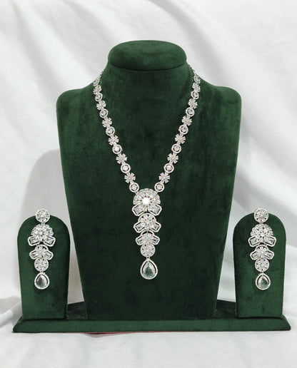 Elegant American Diamond necklace set with floral design, teardrop pendant, and matching earrings – perfect for festive and party wear