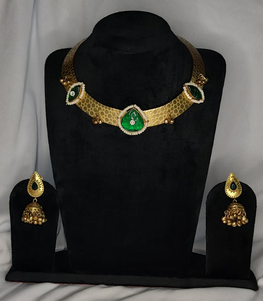 Traditional Hausli necklace set with green stones, pearl detailing, and gold jhumka earrings