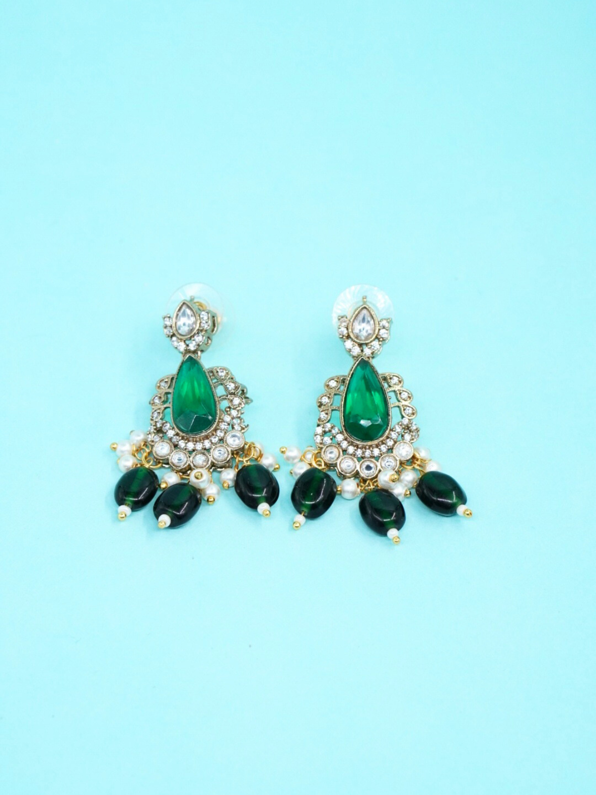 Green onyx  earrings on blue background