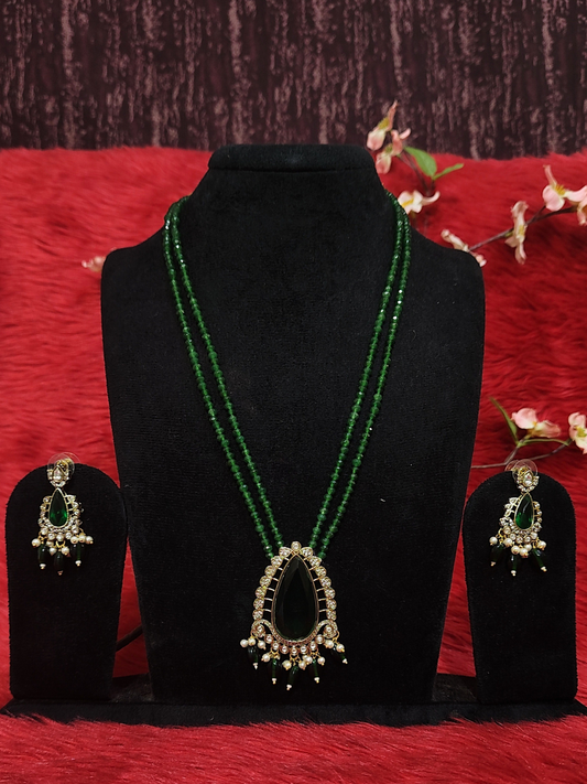 Green onyx long necklace set with matching earrings on dummy