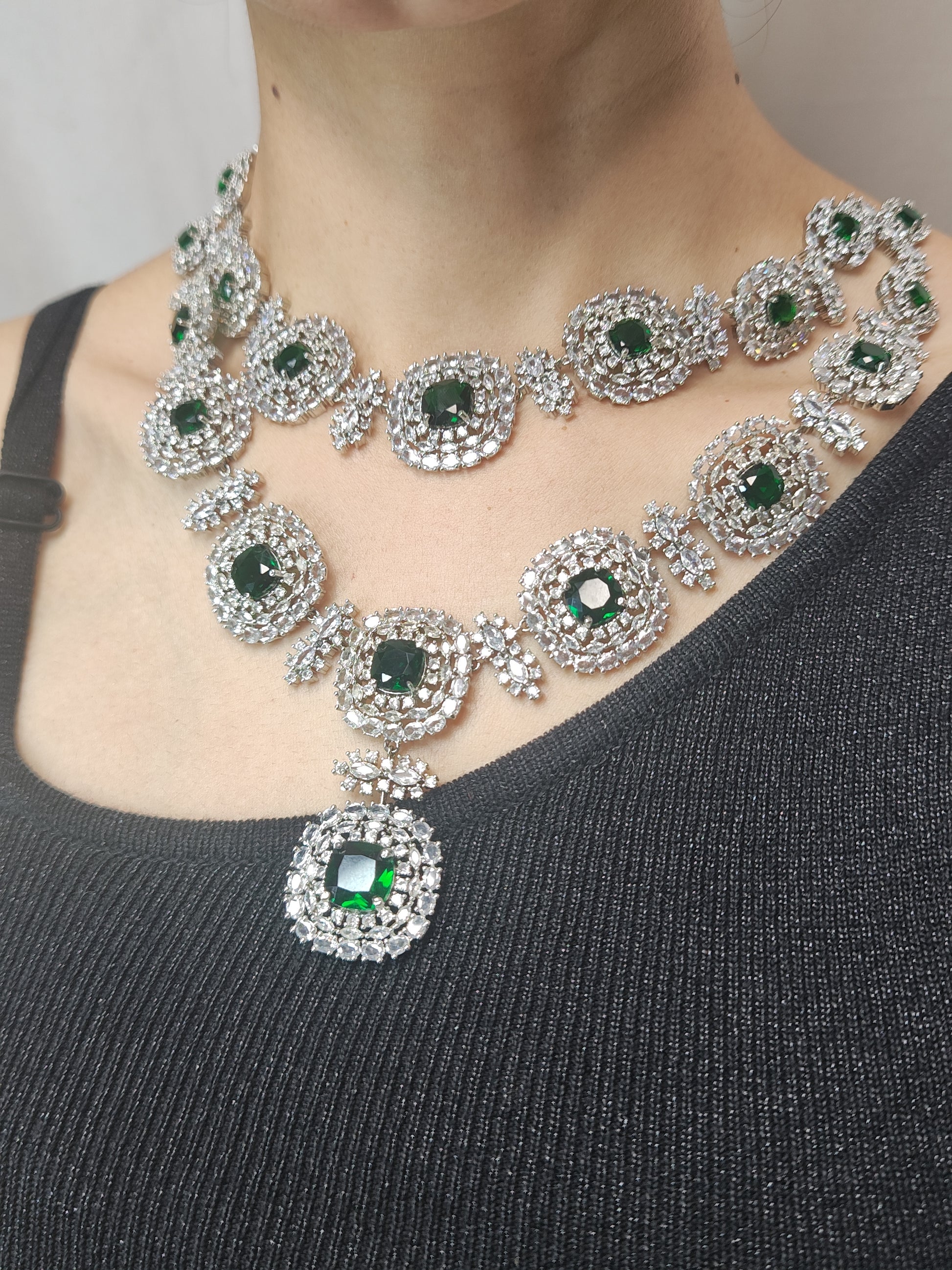 Grand American Diamond bridal necklace set with circular design and emerald green accents – matching earrings included