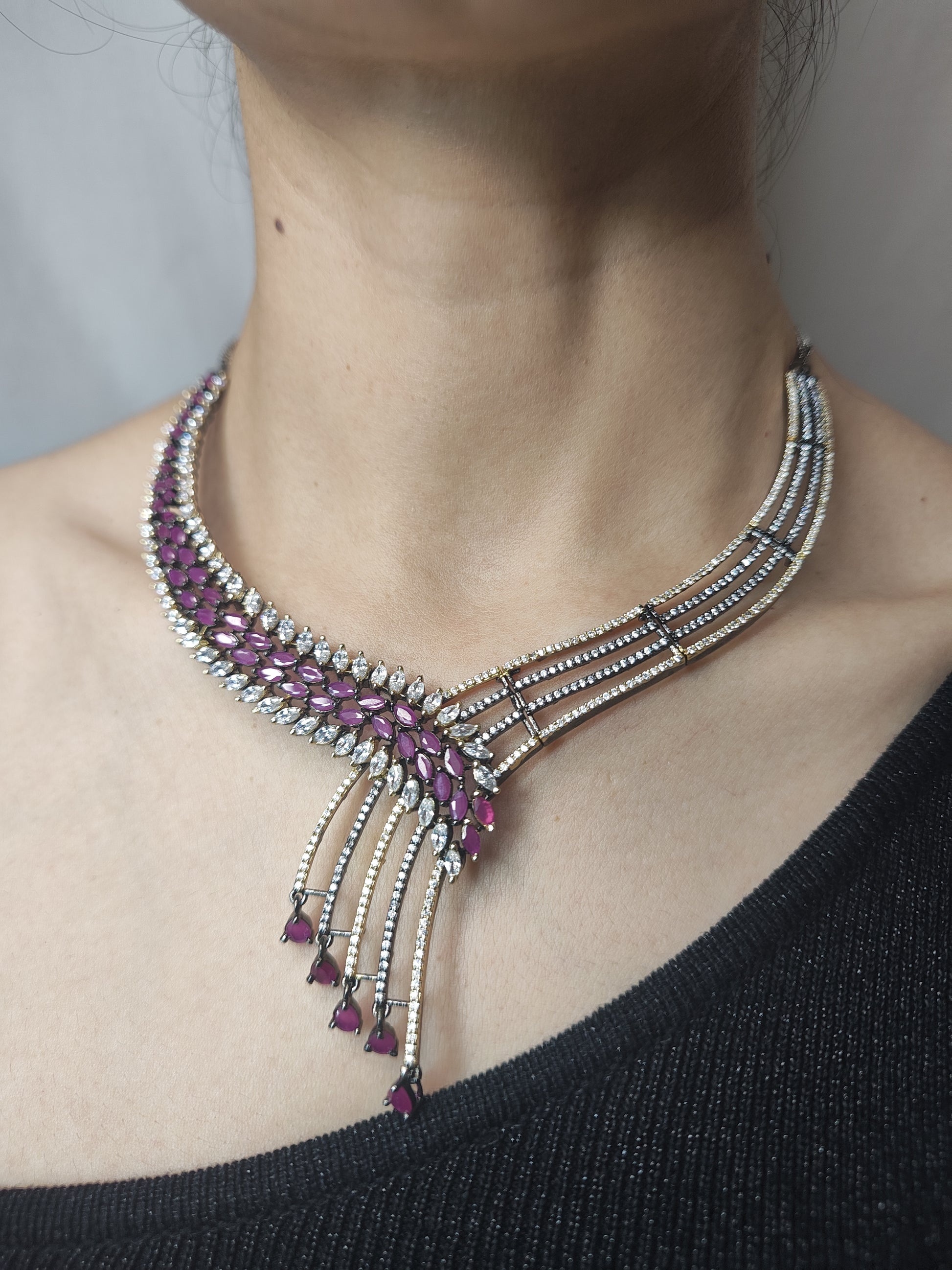 American Diamond necklace set with asymmetrical design, ruby drop beads, and matching earrings – festive jewellery