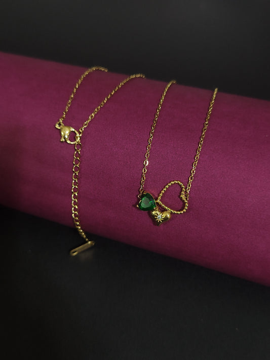 Anti-tarnish heart charm necklace with green stone and floral detail