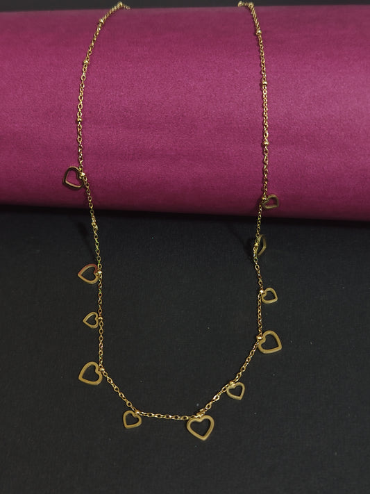 Anti-tarnish gold-plated heart charm necklace with heart-shaped pendants.