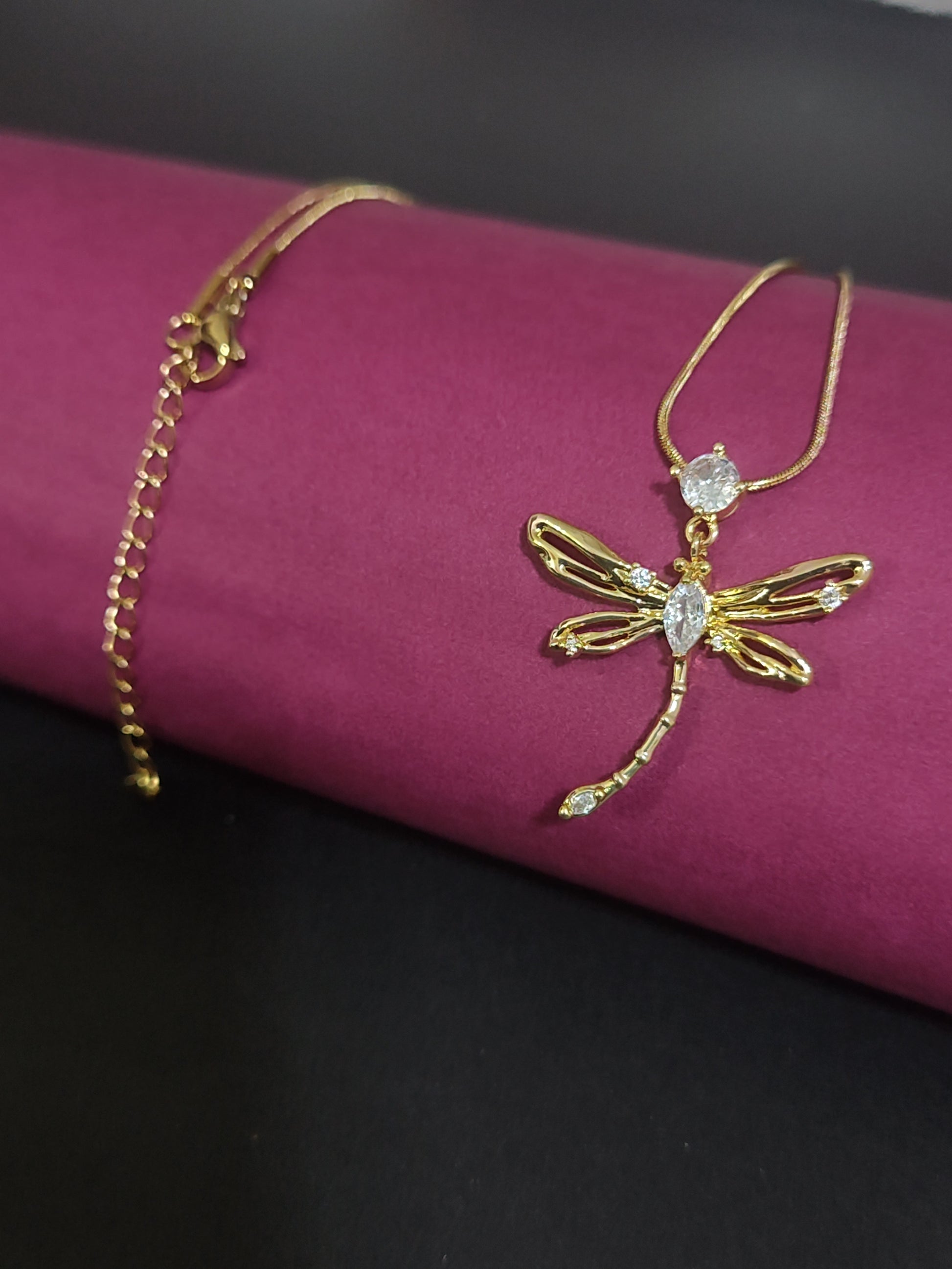 Anti-tarnish dragonfly charm necklace with sparkling stones.