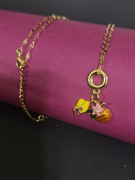 Anti-tarnish fruit and bow charm necklace with cute details.