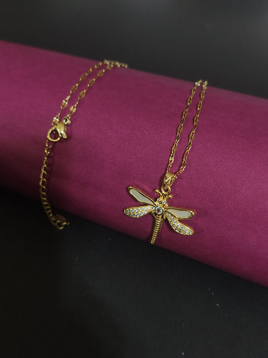Anti-tarnish dragonfly charm necklace with shiny details.