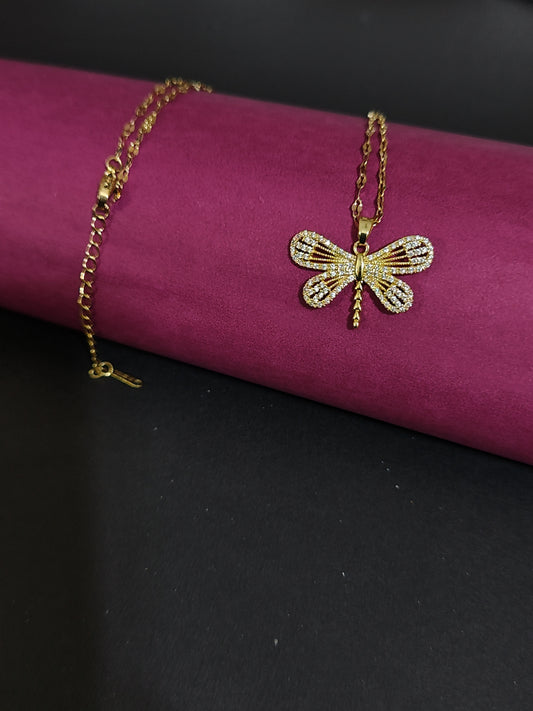 Anti-tarnish dragonfly charm necklace with rhinestone details.