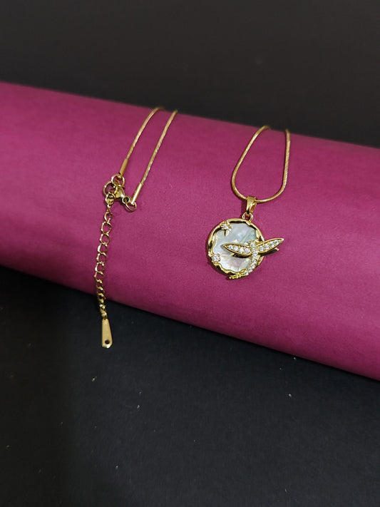 Anti-tarnish bird charm necklace with mother of pearl and rhinestones.