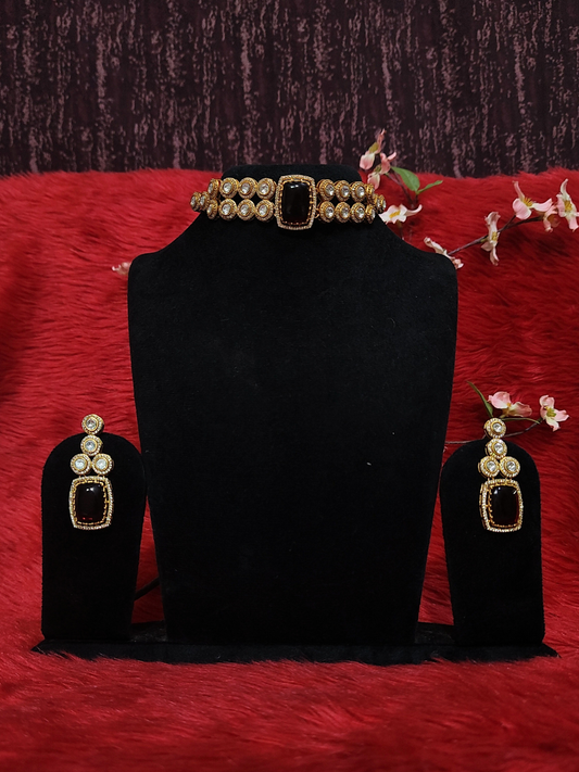 Moissanite choker necklace with ruby red stone and matching earrings on dummy