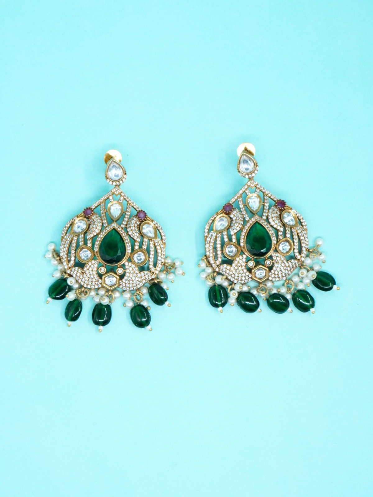 Moissanite stone green drop beads earrings on blue background