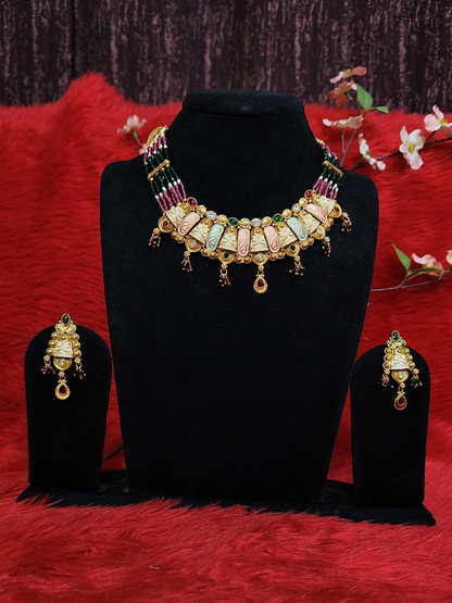 Multicolour beaded choker necklace set with carved panels and matching earrings on dummy