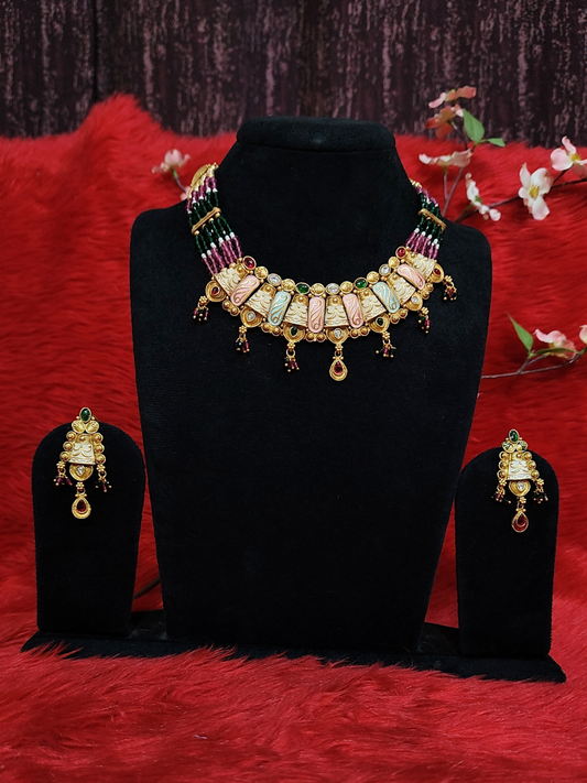 Multicolour beaded choker necklace set with carved panels and matching earrings on dummy