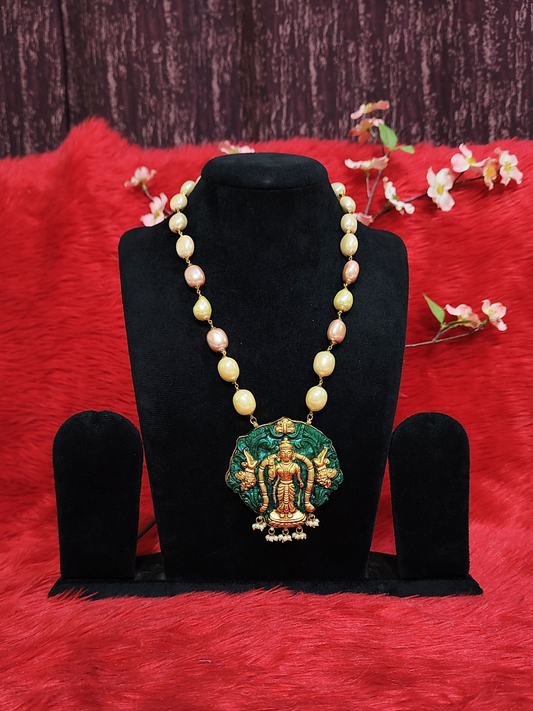 Pearl bead necklace with Lord Venkateswara temple pendant in antique copper and green finish on dummy