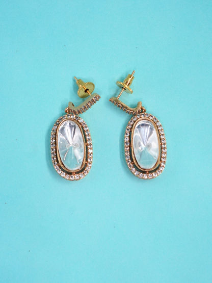 Royal Moissanite oval earrings on blue background