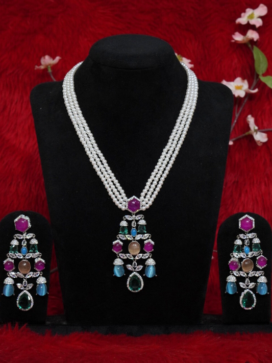 Sabyasachi-inspired pearl necklace set with multi-colored stone pendant and matching earrings on black stand