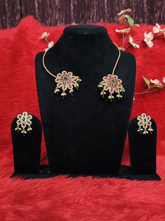 Short floral necklace set with pink and green stone work and matching earrings on copper base