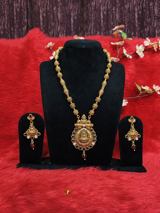 Temple jewelry ball chain necklace set with Lakshmi pendant and matching earrings on dummy