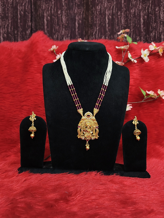Temple necklace set with white and maroon beads, Krishna pendant, and matching jhumka earrings on dummy