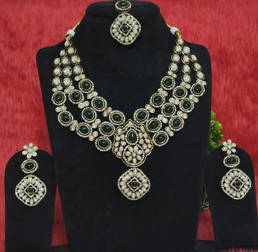 Triple-layer green kundan bridal necklace set with pendant, earrings, and maang tika on display