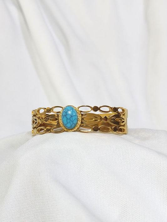 Turquoise stone wide gold finish bracelet with open cut design