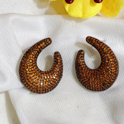 Close-up of Amber Nano Setting AD Crescent Earrings