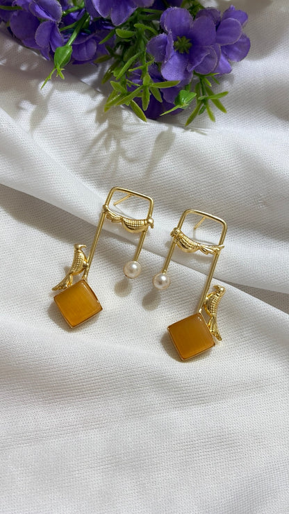 Amber brass bird and artificial pearl statement earrings original view