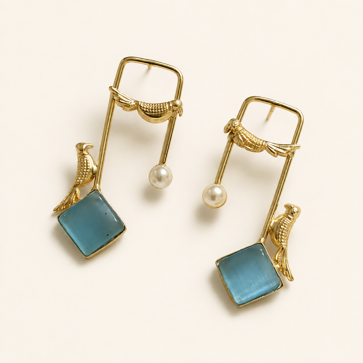 Aqua Blue brass bird and artificial pearl statement earrings on ivory