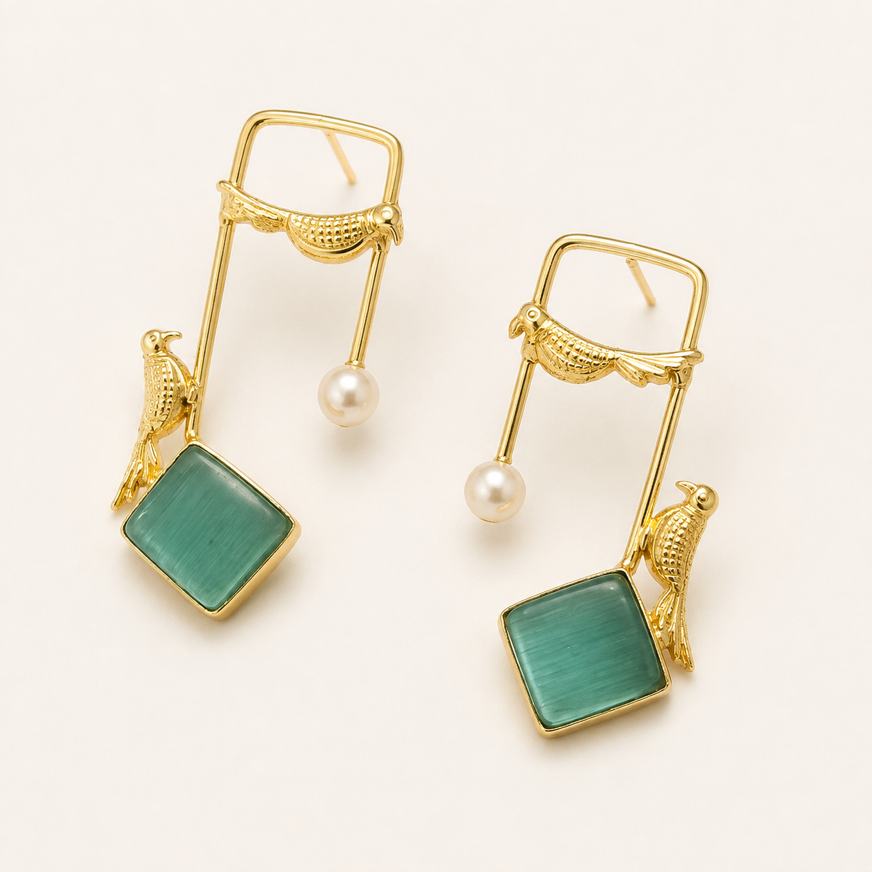 Mint Green brass bird and artificial pearl statement earrings on ivory