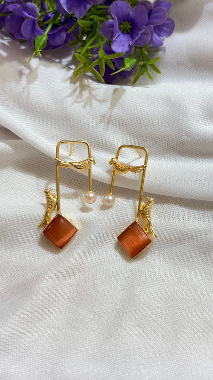 Rust Orange brass bird and artificial pearl statement earrings original view