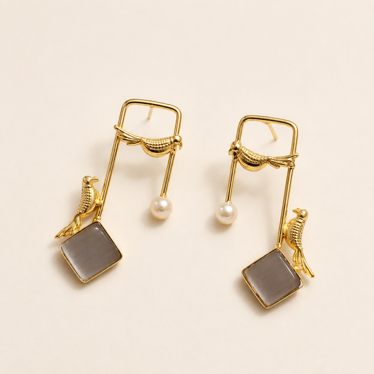 Smoky Grey brass bird and artificial pearl statement earrings on ivory