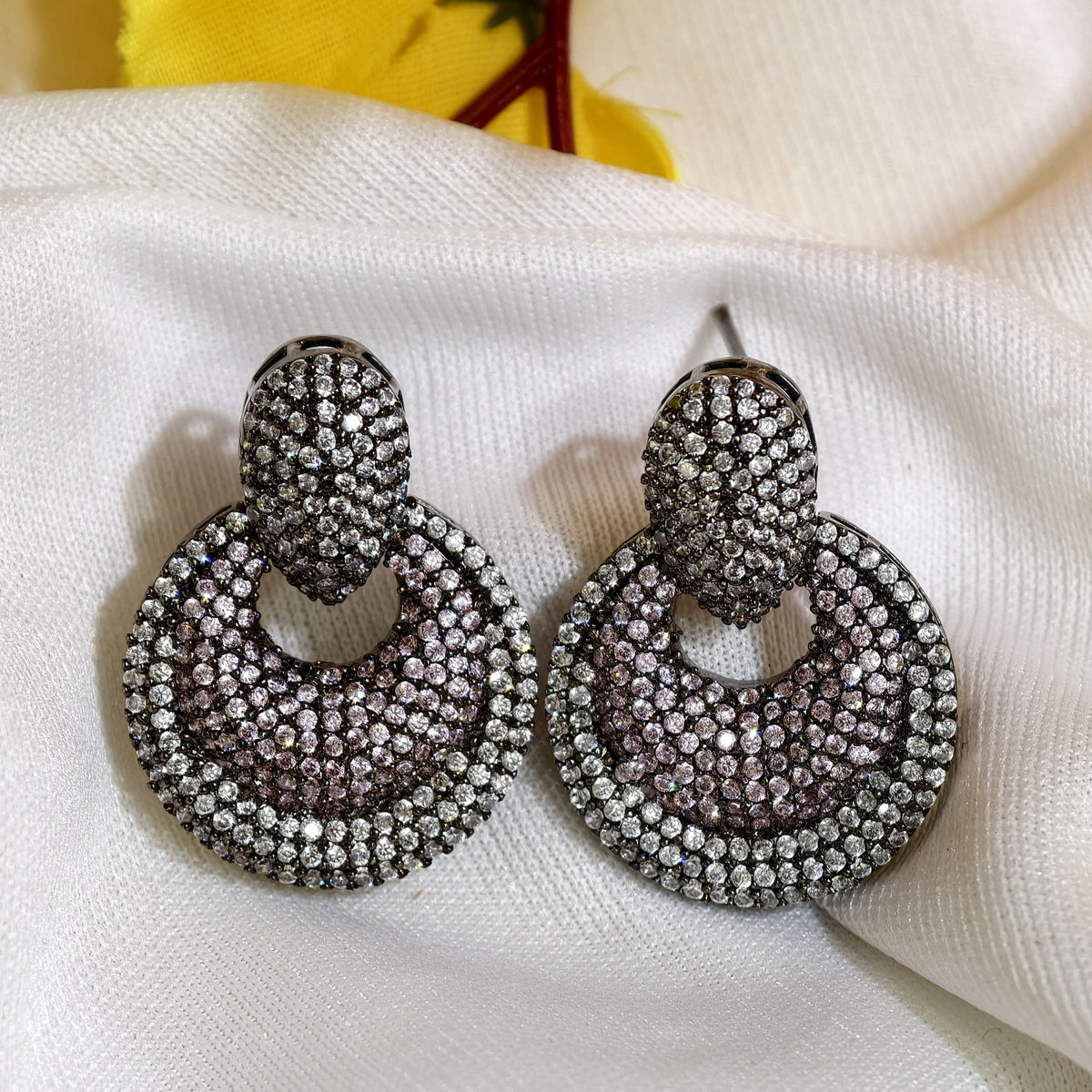 Close-up of Black & White Nano Setting AD Circular Earrings