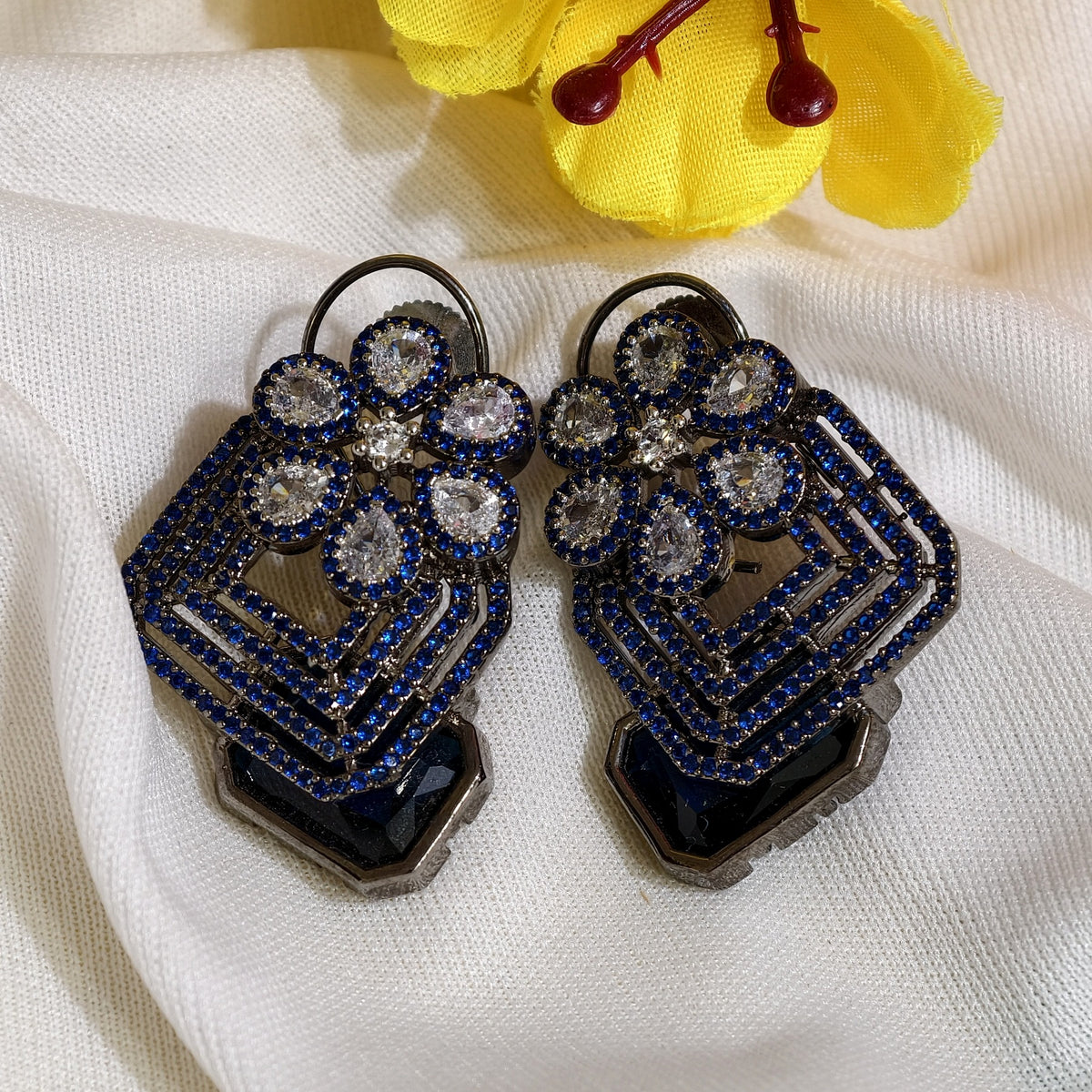 Close-up of Blue Nano Setting AD Geometric Drop Earrings