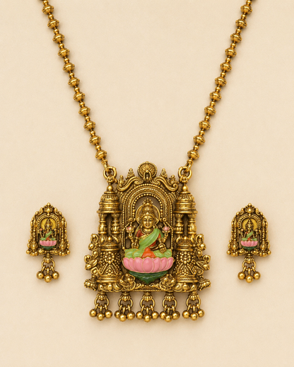 Close detail of brass Lakshmi pendant and matching earrings