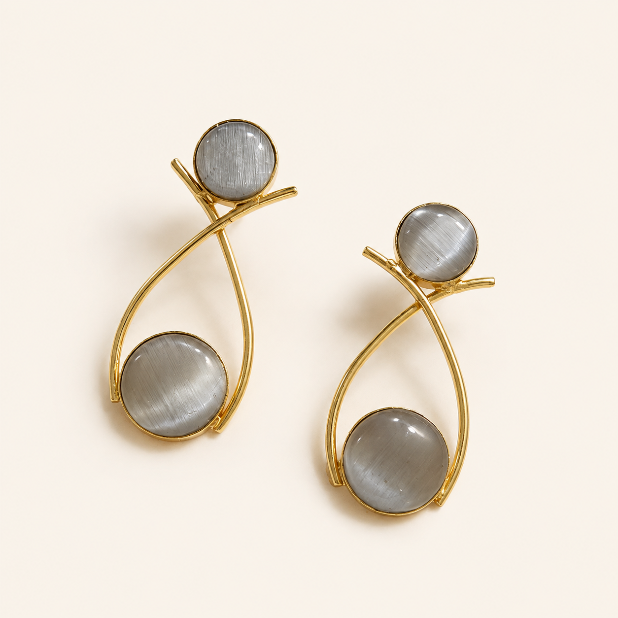 Pearl Grey brass double-circle loop earrings on ivory