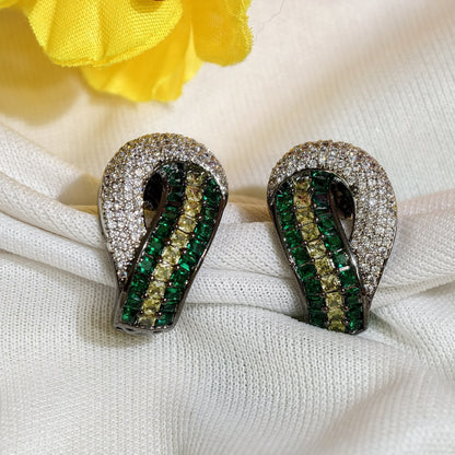 Close-up of Emerald Green Nano Setting AD Huggie Earrings
