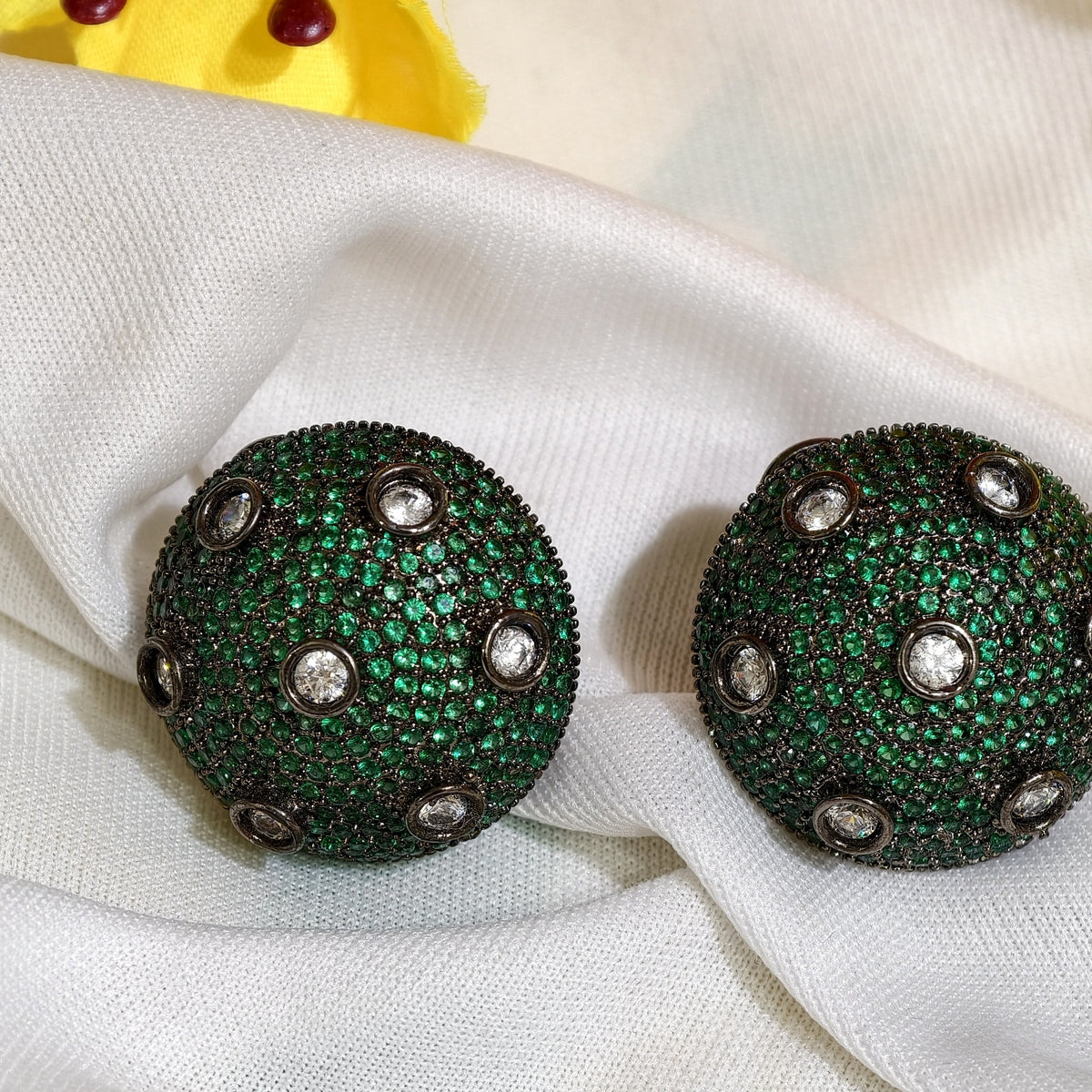 Close-up of Emerald Green Nano Setting AD Round Stud Earrings