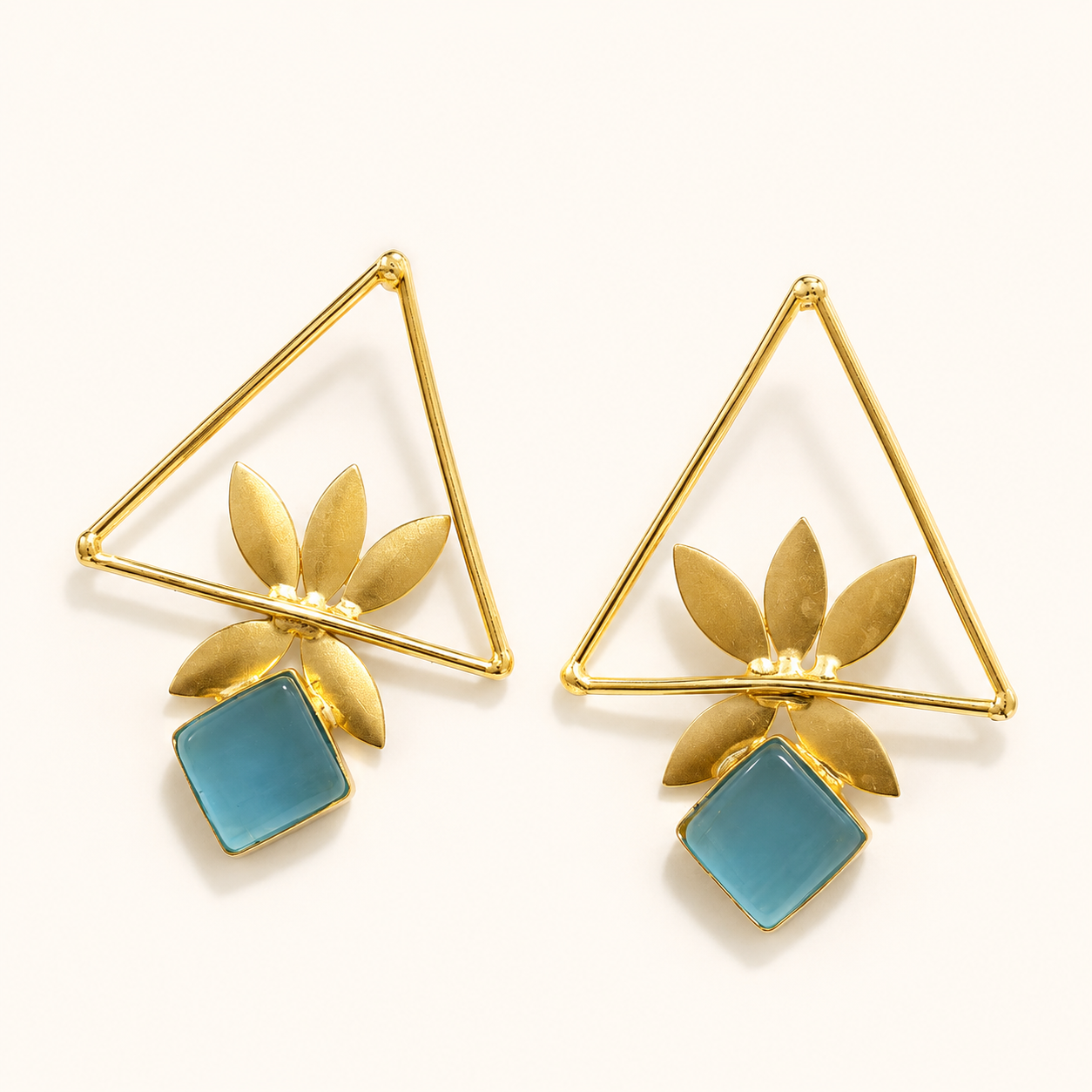 Aqua Blue brass geometric leaf statement earrings on ivory