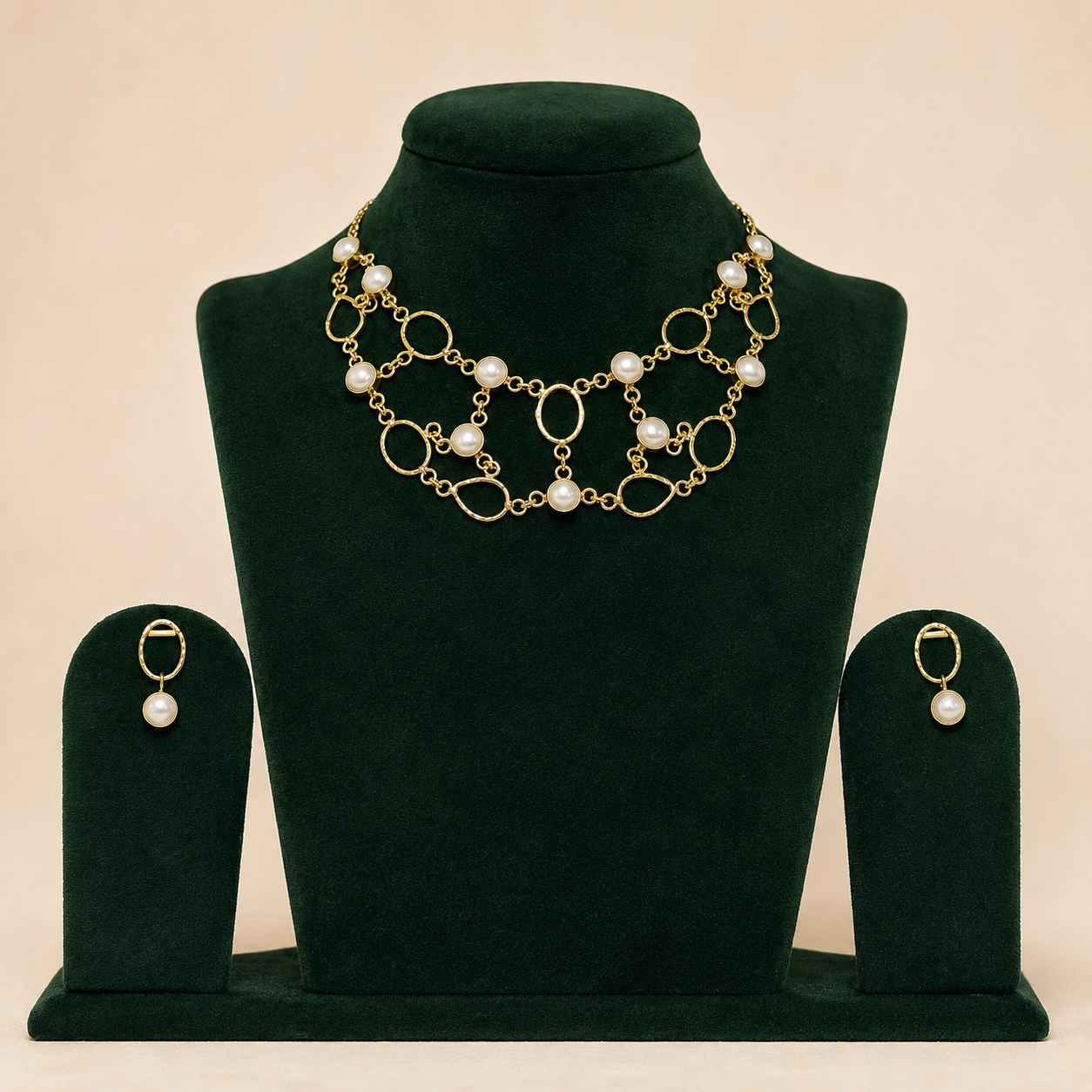 Handmade brass statement necklace and matching earrings on green velvet display