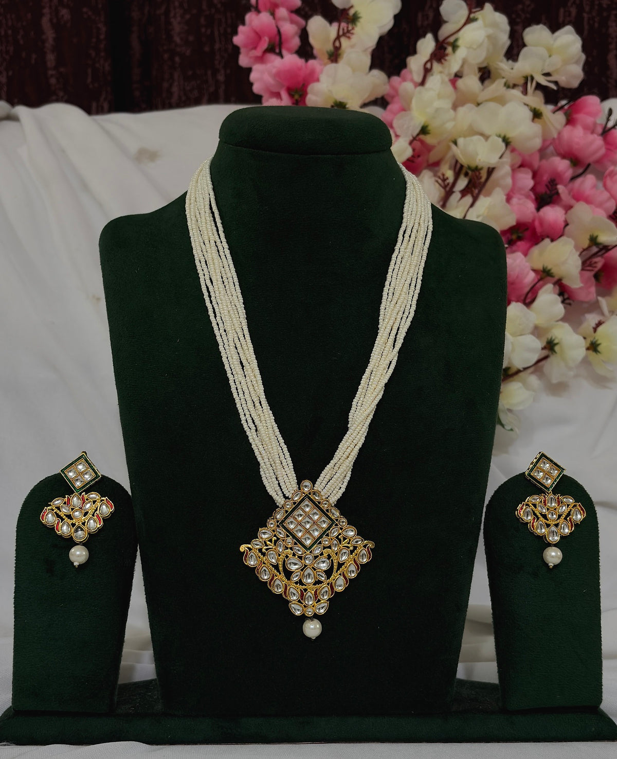 Kundan-style pearl-strand long necklace set with matching earrings