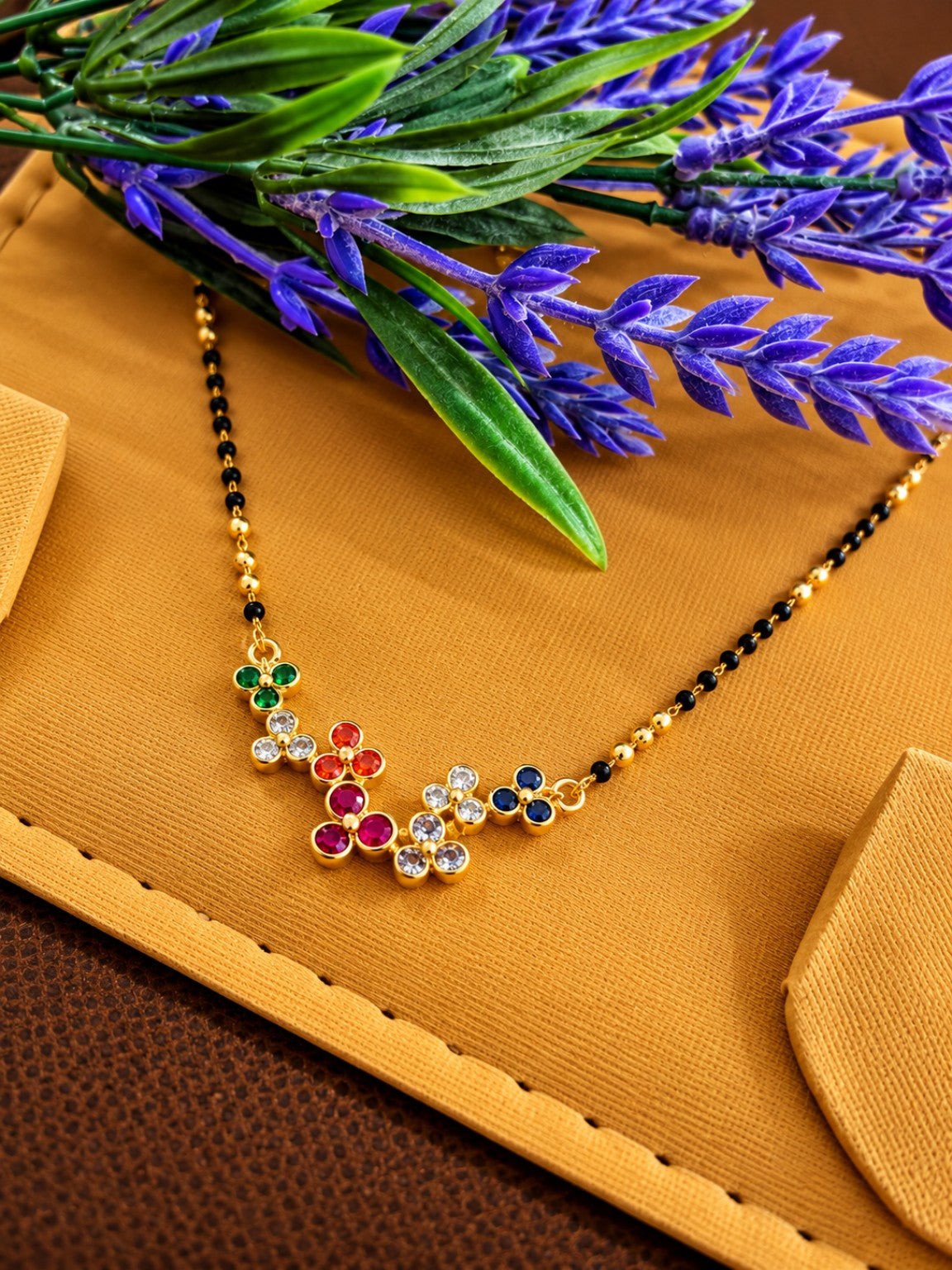 Micro gold-plated black bead mangalsutra with multicolour floral stone pendant design